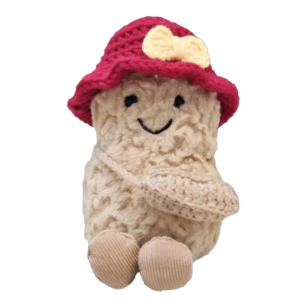 Jellycat Amuseables Peanut keychain wearing a red bucket hat head cover and holding a matching small red bag.