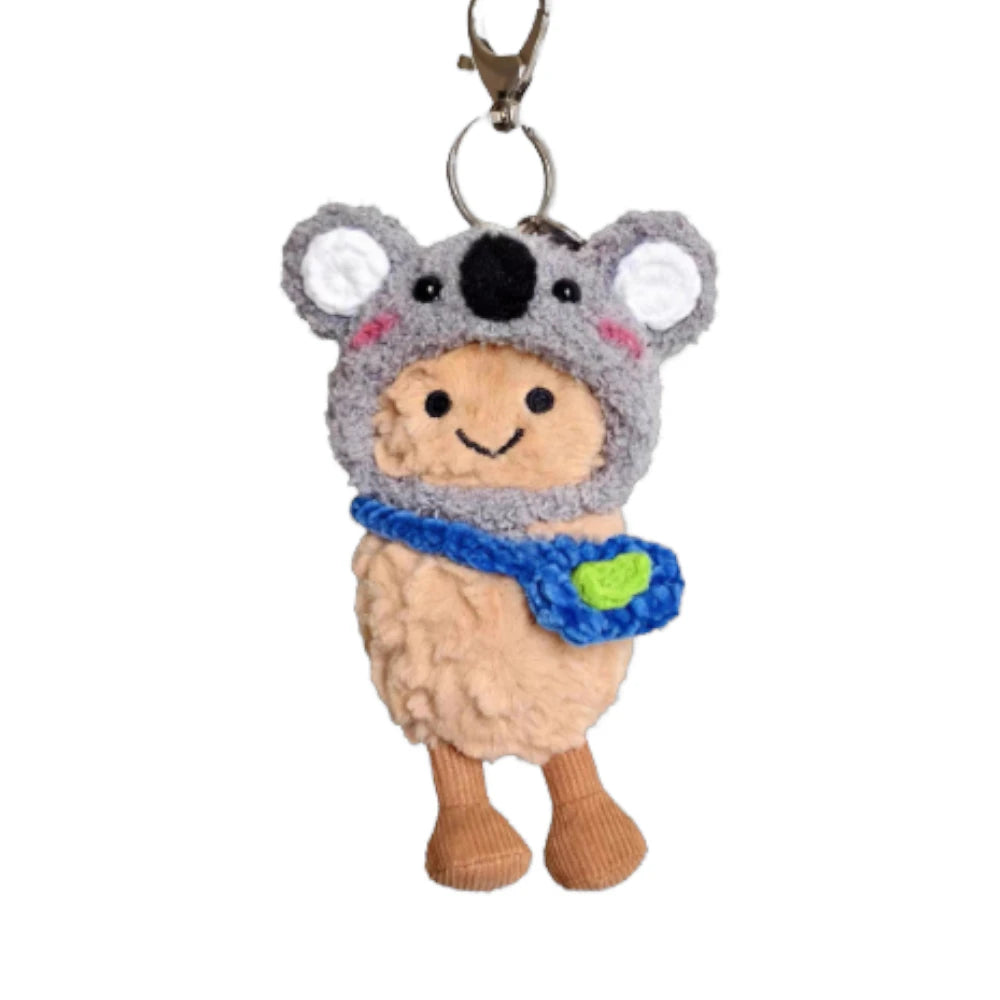 Jellycat Amuseables Peanut keychain wearing a koala-themed head cover and holding a matching small bag.
