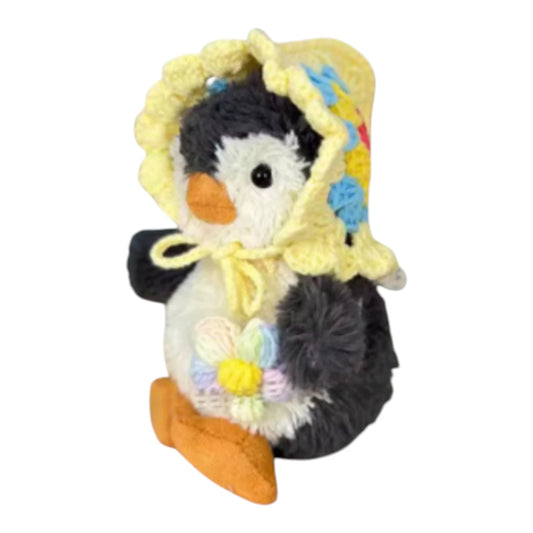 Jellycat Peanut Penguin Bag Charm wearing a granny square hat and holding a matching small bag, available in multiple colors.