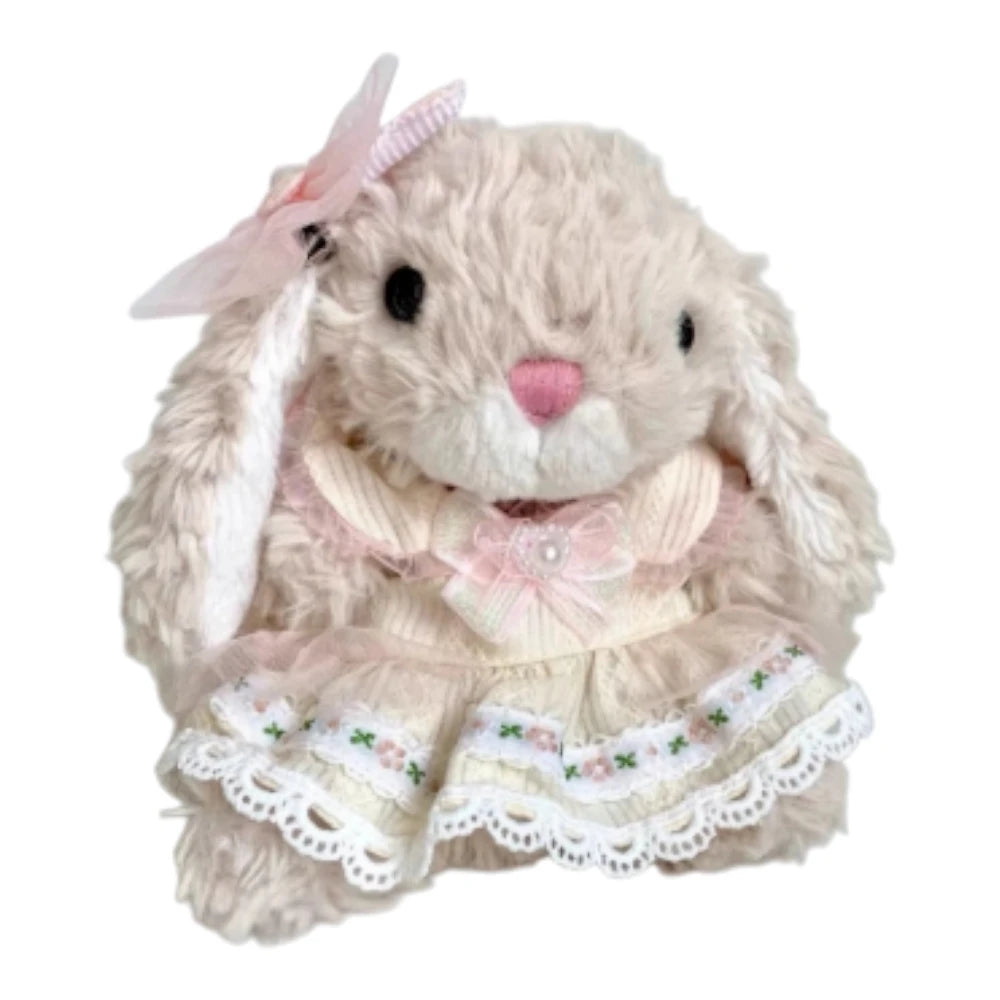 Jellycat Yummy Bunny plush wearing a peach-themed dress and a matching bow headband.