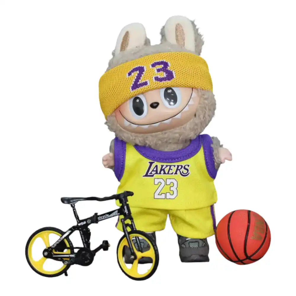 Labubu plush toy wearing the complete NBA Lakers No. 23 outfit, featuring a yellow and purple jersey, matching shorts, headband, and a basketball charm.