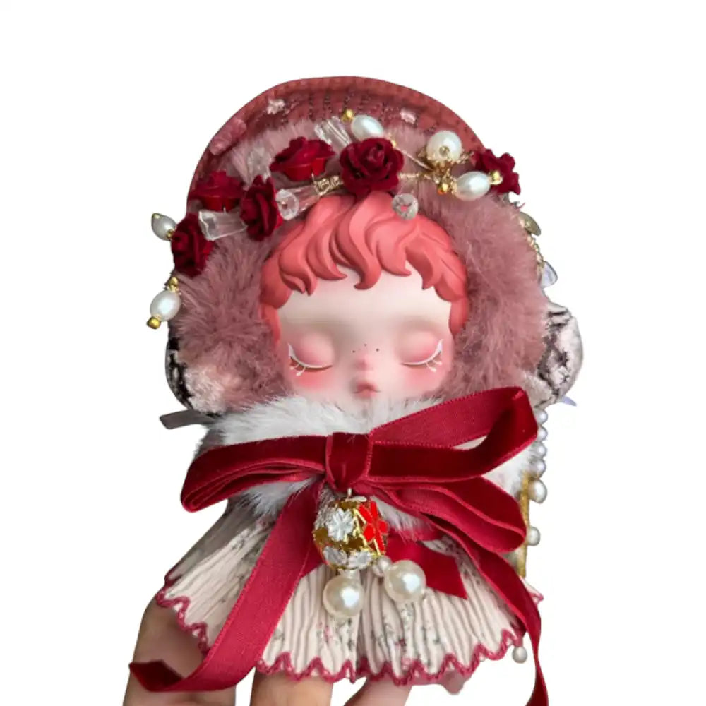 Skullpanda plush figure wearing the Red Bells Pearls Outfit, featuring a pearl-embellished plush hood, a floral print dress, and a crimson velvet bow with a bell and pearl accessories.