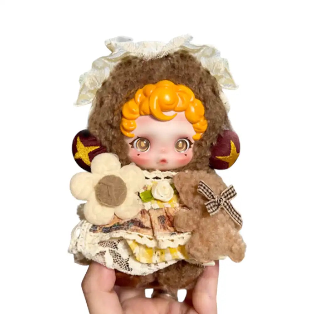 Skullpanda plush figure wearing the Bear Palace Outfit, featuring a plush bear hood, a layered fabric dress with crochet, a fabric daisy, and a miniature teddy bear appliqué.