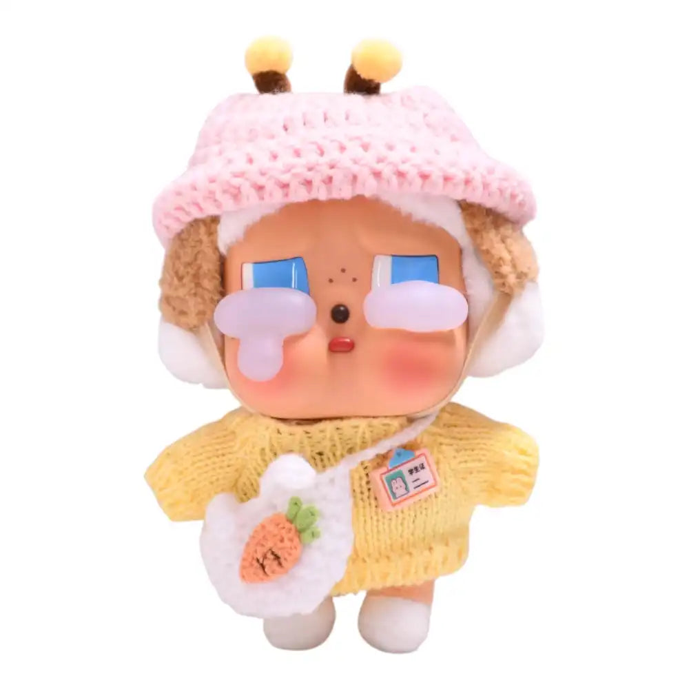 Crybaby figure wearing a 3-piece Yellow Sweater Outfit set, including a yellow top, matching hat, and small bag accessory.