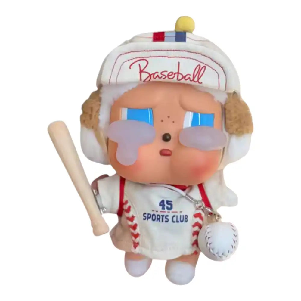 Crybaby figure wearing a 4-piece Baseball Outfit, including a uniform top, cap, miniature baseball bat accessory, and small bag.