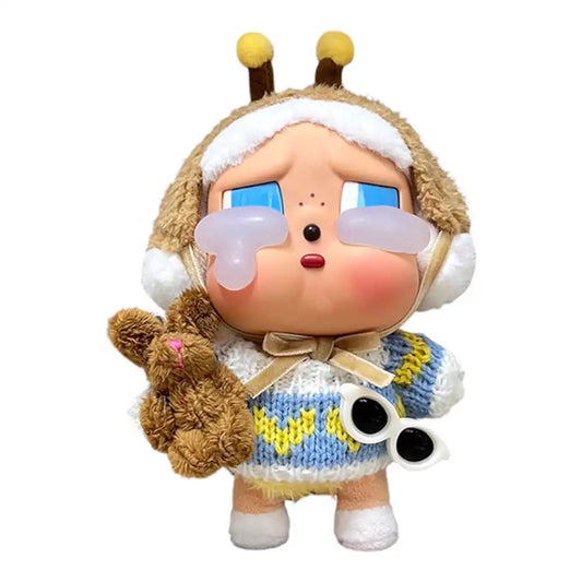 Crybaby figure wearing a 3-piece Baby Blue Sweater Outfit, including a blue and yellow sweater, sunglasses, and a rabbit toy accessory.