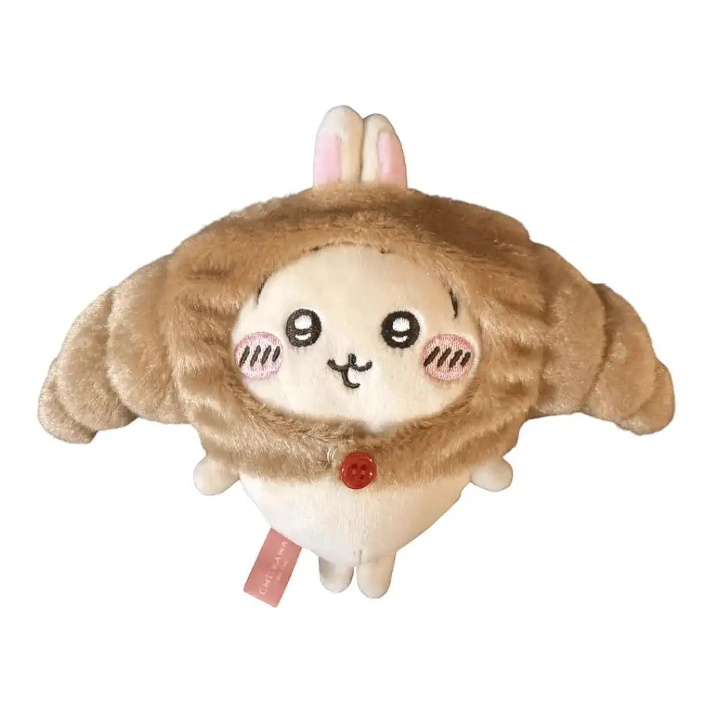 Chiikawa 10cm plush toy wearing a brown croissant-shaped head cover accessory.