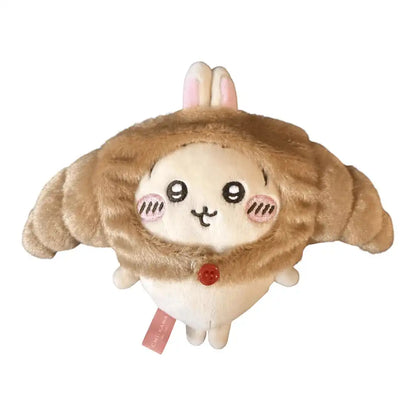 Chiikawa 10cm plush toy wearing a brown croissant-shaped head cover accessory.