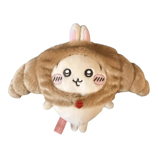 Chiikawa 10cm plush toy wearing a brown croissant-shaped head cover accessory.