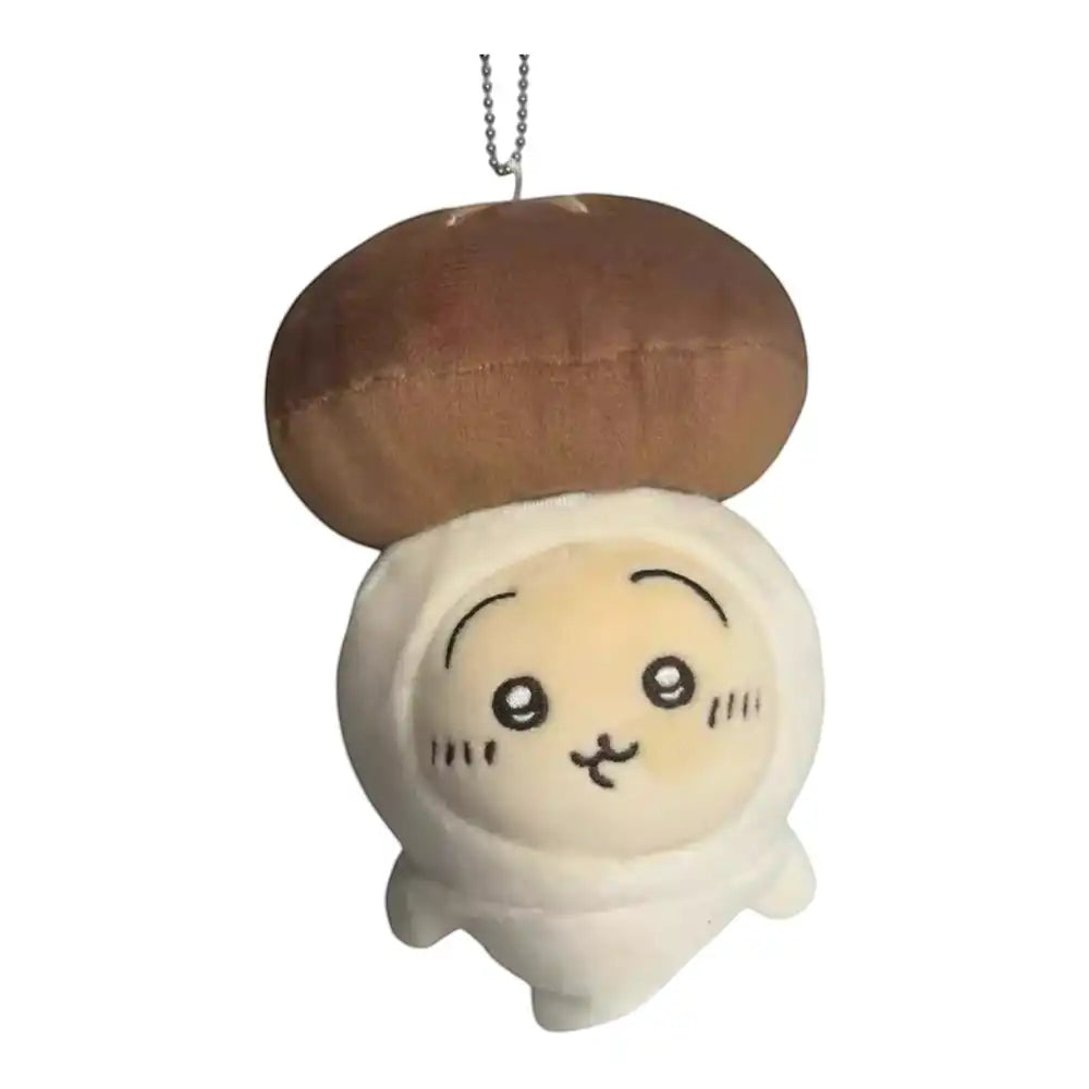 Chiikawa 10cm plush toy wearing a brown and white mushroom-themed outfit, resembling an edible mushroom.