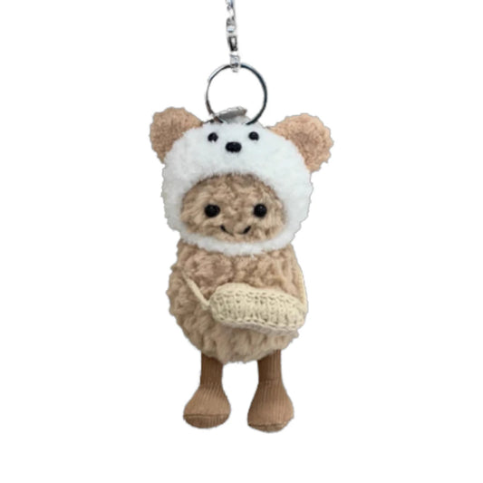 Jellycat Amuseables Peanut keychain wearing a dog-themed head cover and holding a matching small bag.