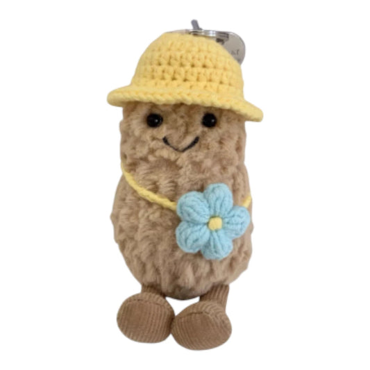 Jellycat Amuseables Peanut keychain wearing a yellow bucket hat head cover and holding a matching small yellow bag.