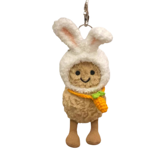 Jellycat Amuseables Peanut keychain wearing a rabbit-themed head cover with ears and holding a matching small bag.
