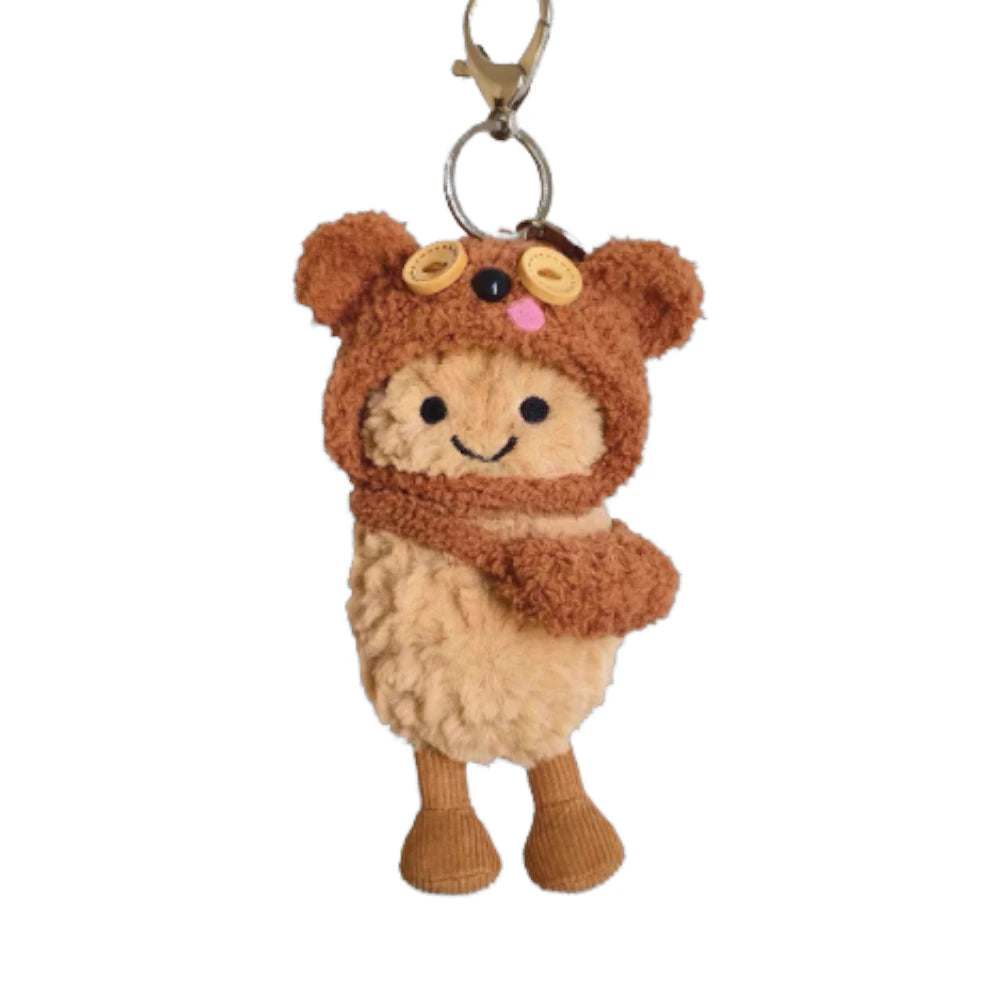 Jellycat Amuseables Peanut keychain wearing a Tim Bear-themed head cover and holding a matching small bag.