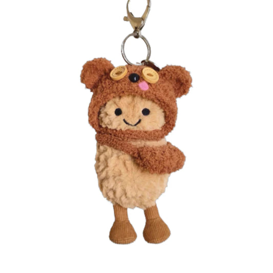 Jellycat Amuseables Peanut keychain wearing a Tim Bear-themed head cover and holding a matching small bag.