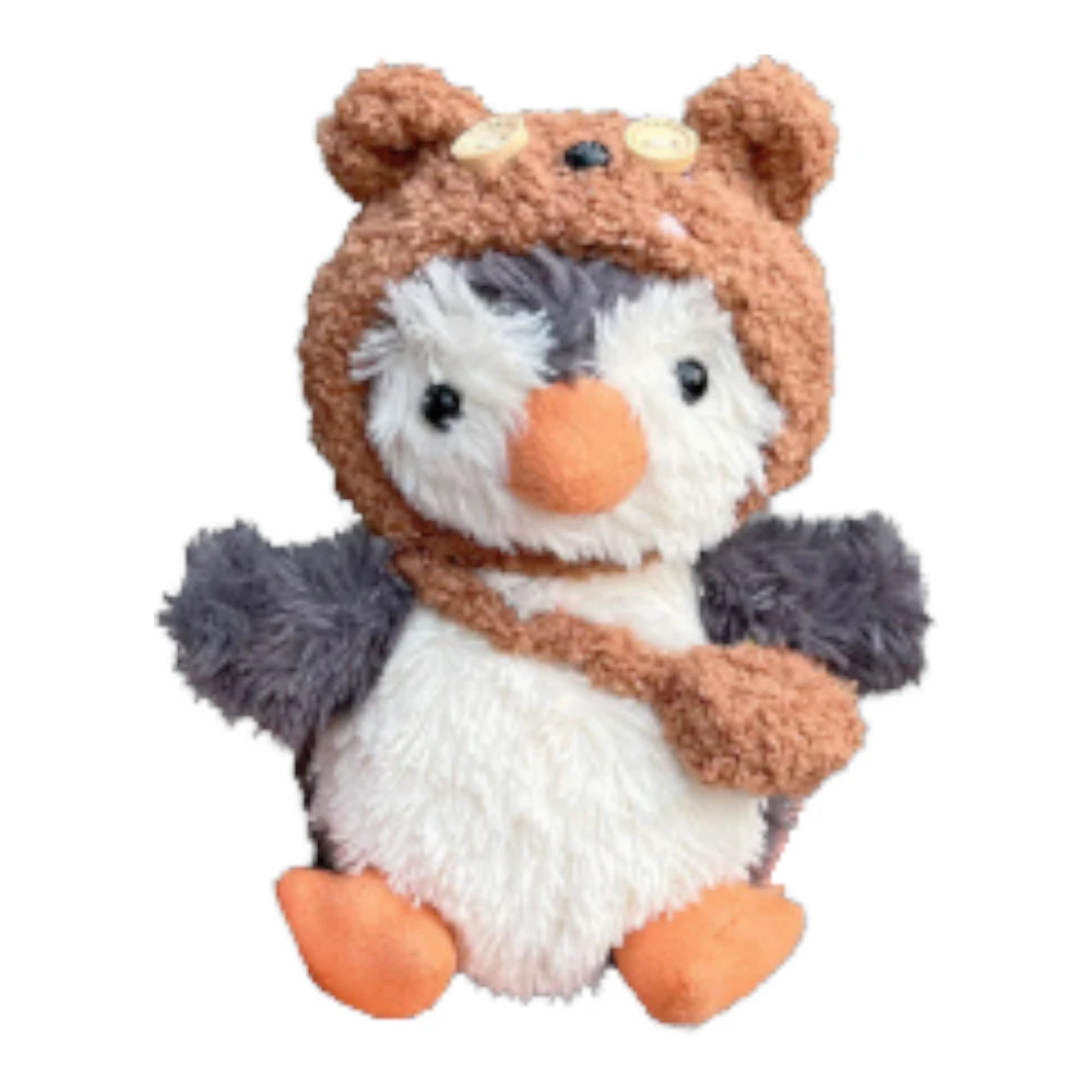 Jellycat Peanut Penguin Bag Charm wearing a Tim Bear-themed head cover and holding a matching small bag.