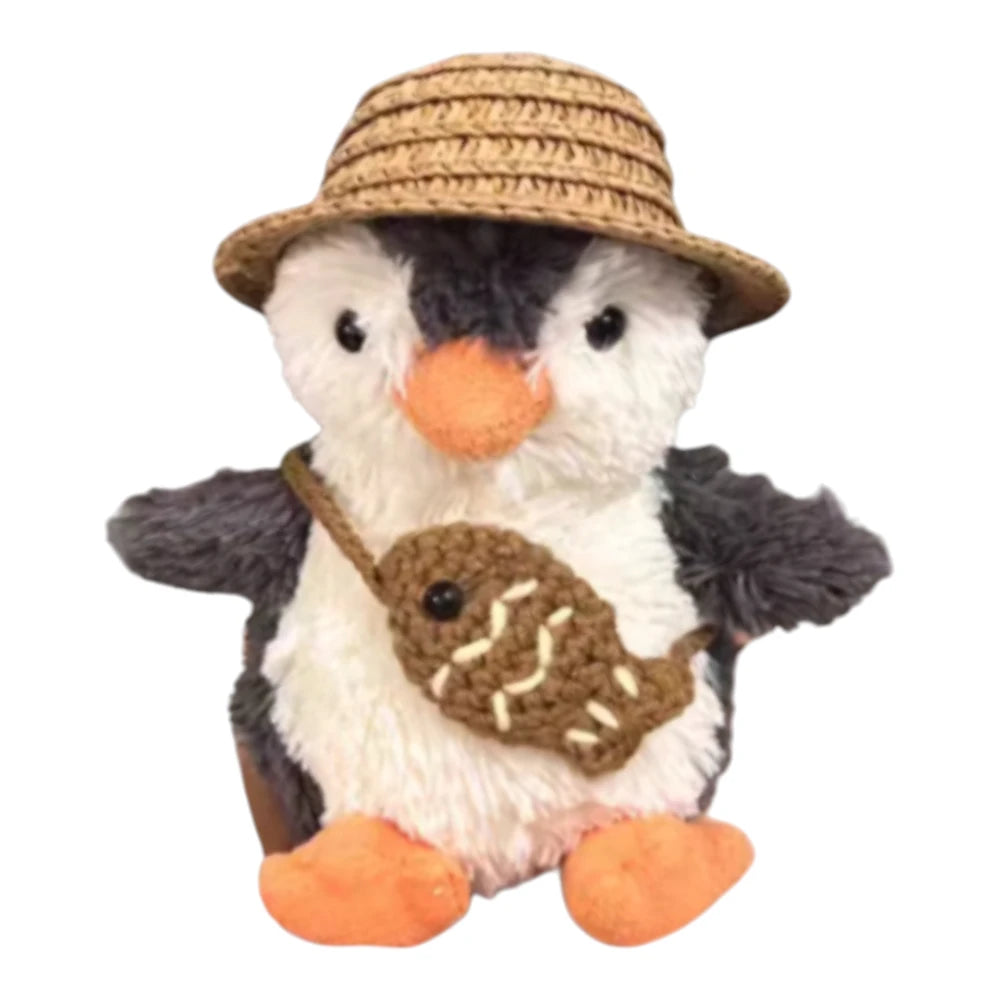 Jellycat Peanut Penguin Bag Charm wearing a straw hat and holding a matching small bag, available in two colors.