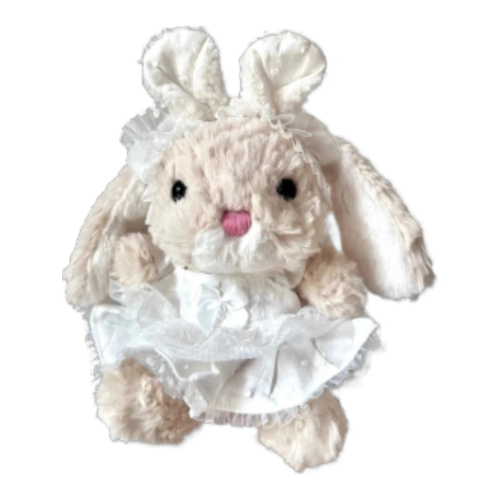 Jellycat Yummy Bunny plush wearing a white wedding dress and a white bunny ear headband.