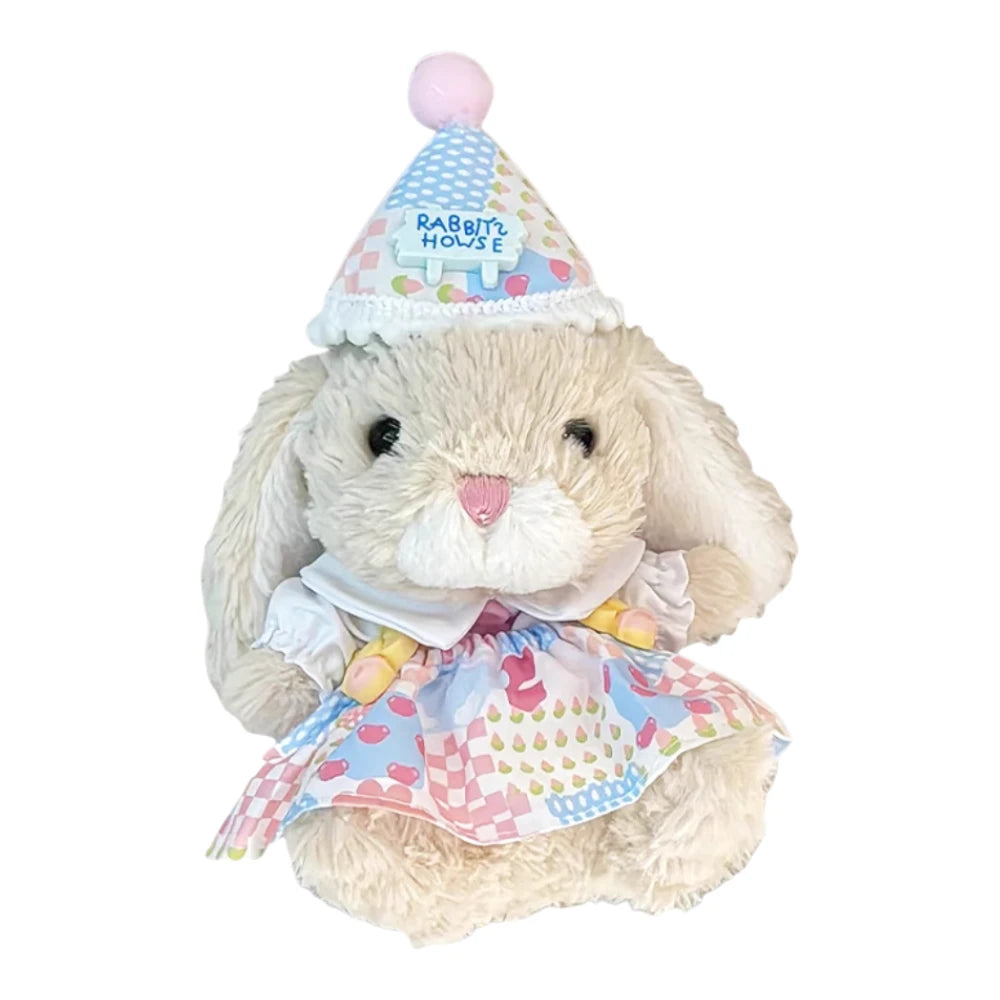 Jellycat Yummy Bunny plush wearing a birthday dress and a matching party hat.