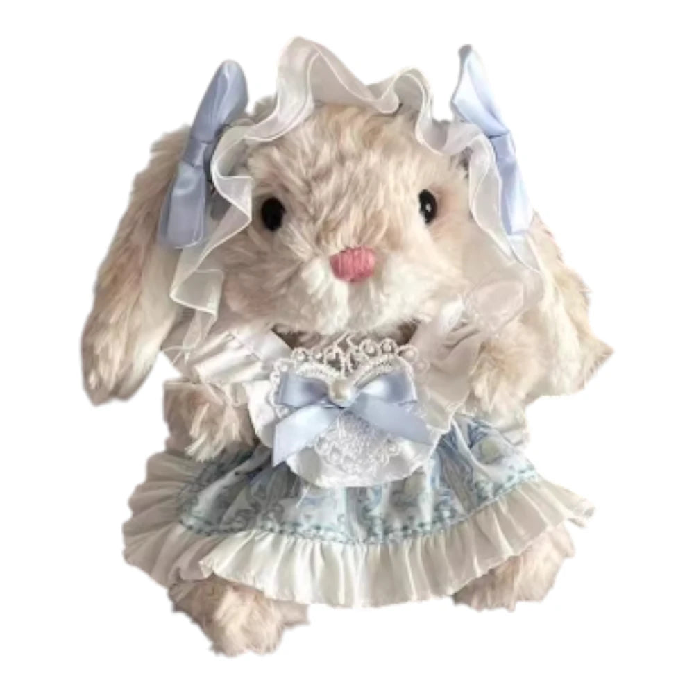 Jellycat Yummy Bunny plush wearing a blue dress and a matching blue headband.