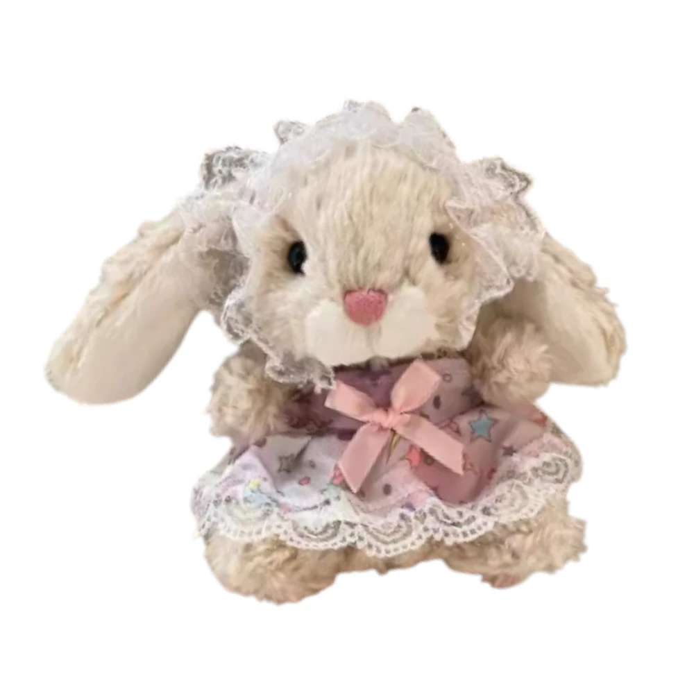 Jellycat Yummy Bunny plush wearing a pink dress, a pearl necklace, and a matching bow headband.