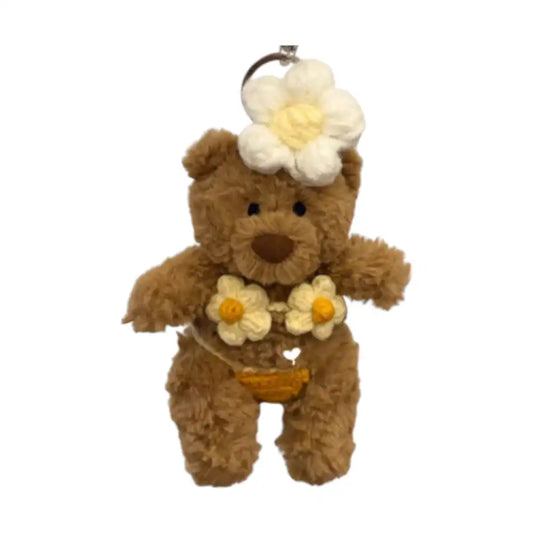 Jellycat Bartholomew Bear Bag Charm wearing a colorful bikini set and a matching headpiece.
