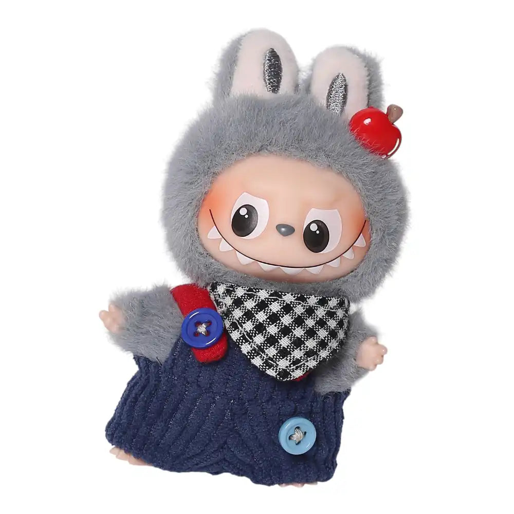 Labubu 4.0 figure wearing blue pants, an apple head plug, and a black and white checkered scarf accessory.