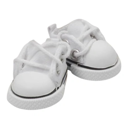 A colorful array of 8 pairs of handmade canvas shoes for Labubu, displayed in white, pink, black, red, yellow, light blue, green, and purple.