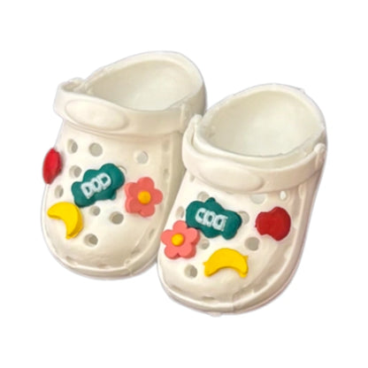 A display of 8 pairs of miniature clogs for Labubu, featuring various two-tone color combinations such as mud yellow-white, pink-white, and light blue-white.