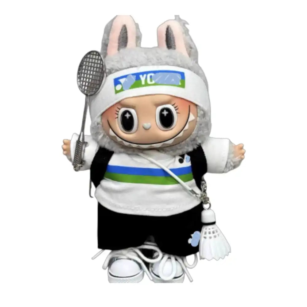 Labubu plush toy wearing the complete 9-item Yonex Badminton Outfit Boy Set, including cap, top, pants, bag, shoes, headband, water bottle, racket, and shuttlecock.