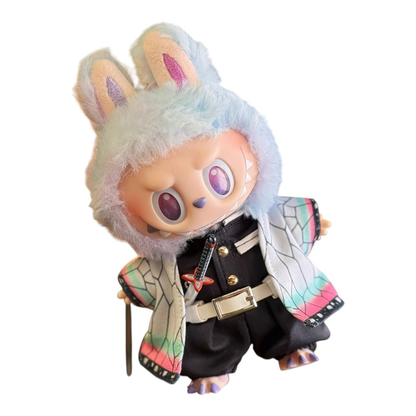 Labubu wearing a Shinobu Kocho style outfit, including a butterfly-patterned haori, black uniform top, pants, white belt, butterfly hair ornament, and a slender Nichirin sword.