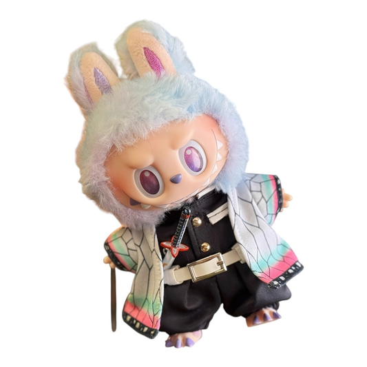 Labubu wearing a Shinobu Kocho style outfit, including a butterfly-patterned haori, black uniform top, pants, white belt, butterfly hair ornament, and a slender Nichirin sword.