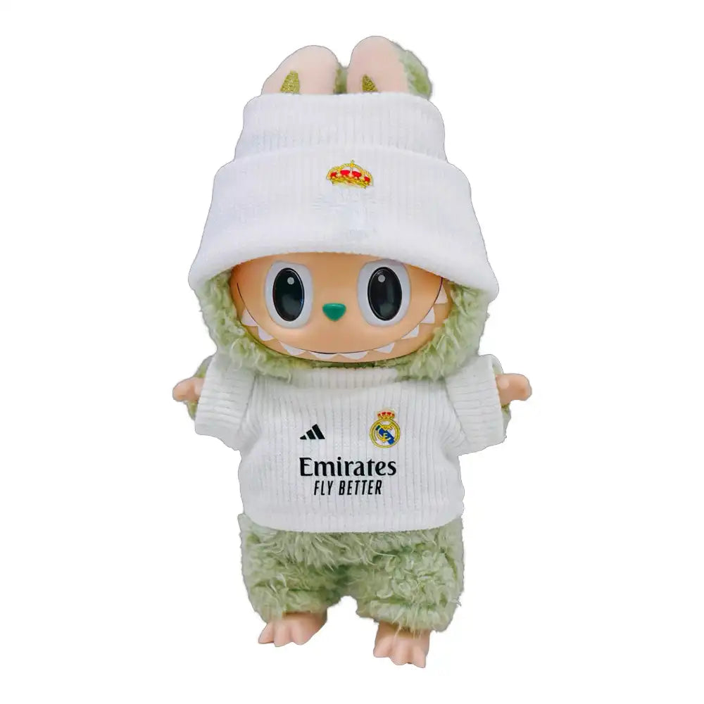 Labubu plush toy wearing a custom Real Madrid Football Club jersey outfit with a chosen player number, including a white replica jersey and a coordinating hat.