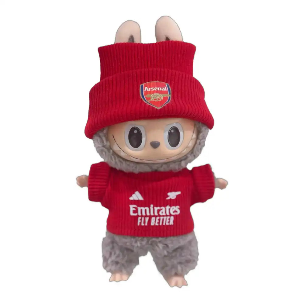 Labubu plush toy wearing the complete Arsenal Football Club jersey outfit, featuring a red and white replica jersey and a coordinating hat.
