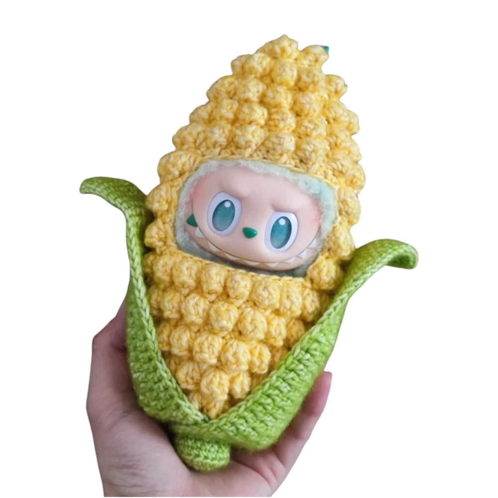 Labubu plush toy wearing a complete corn-themed outfit, designed to resemble a charming ear of corn with kernels and a husk.