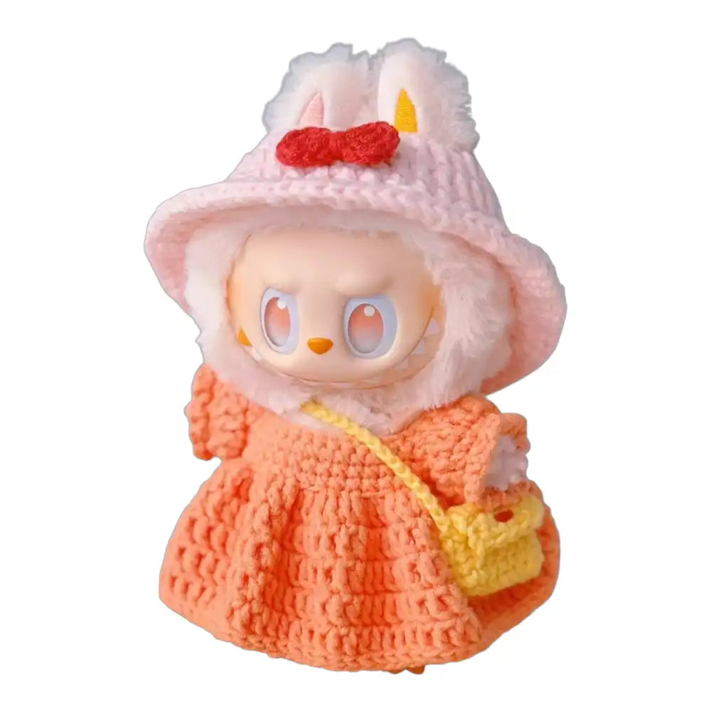 Labubu plush toy wearing a complete crochet dress outfit in a vibrant orange color, providing a full and stylish look.