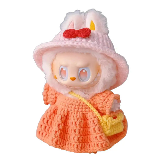 Labubu plush toy wearing a complete crochet dress outfit in a vibrant orange color, providing a full and stylish look.