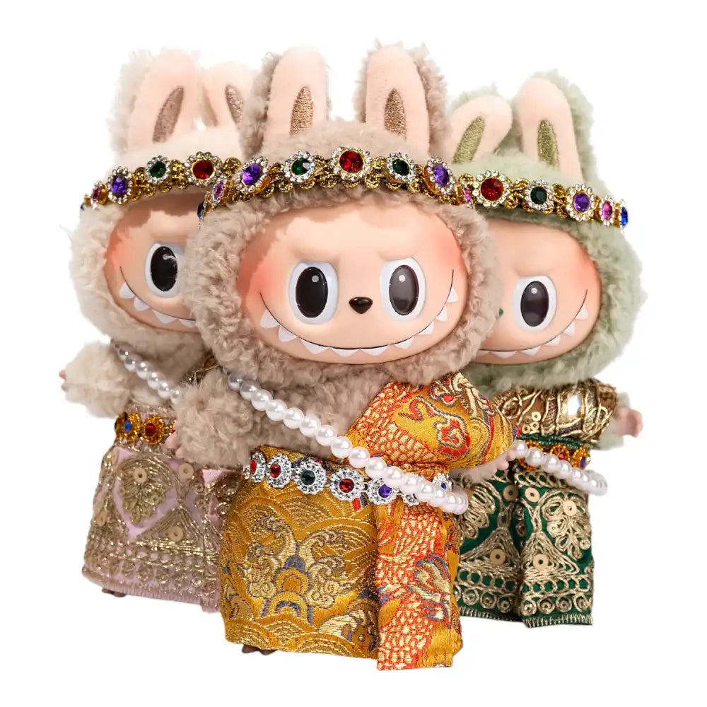 Labubu plush toy wearing a complete traditional Thai clothing outfit with a stylish headband, available in pink and gold, green and gold, or yellow and gold color combinations.