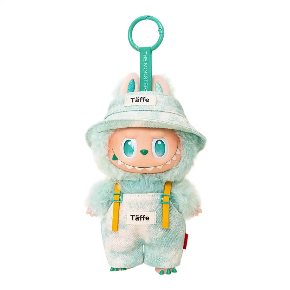 Labubu plush toy wearing a 2-piece printed overalls outfit, including overalls and a bucket hat, available in green, red, pink, blue stripe, or cyan.