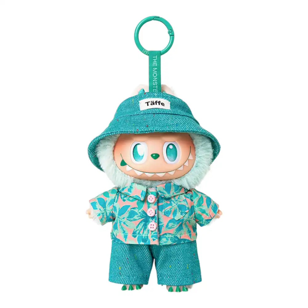 Labubu plush toy wearing a 3-piece leisure vacation shirt outfit, including a bucket hat, shirt, and jeans. Available in an all-green style or a blue hat and jeans with a floral shirt style.