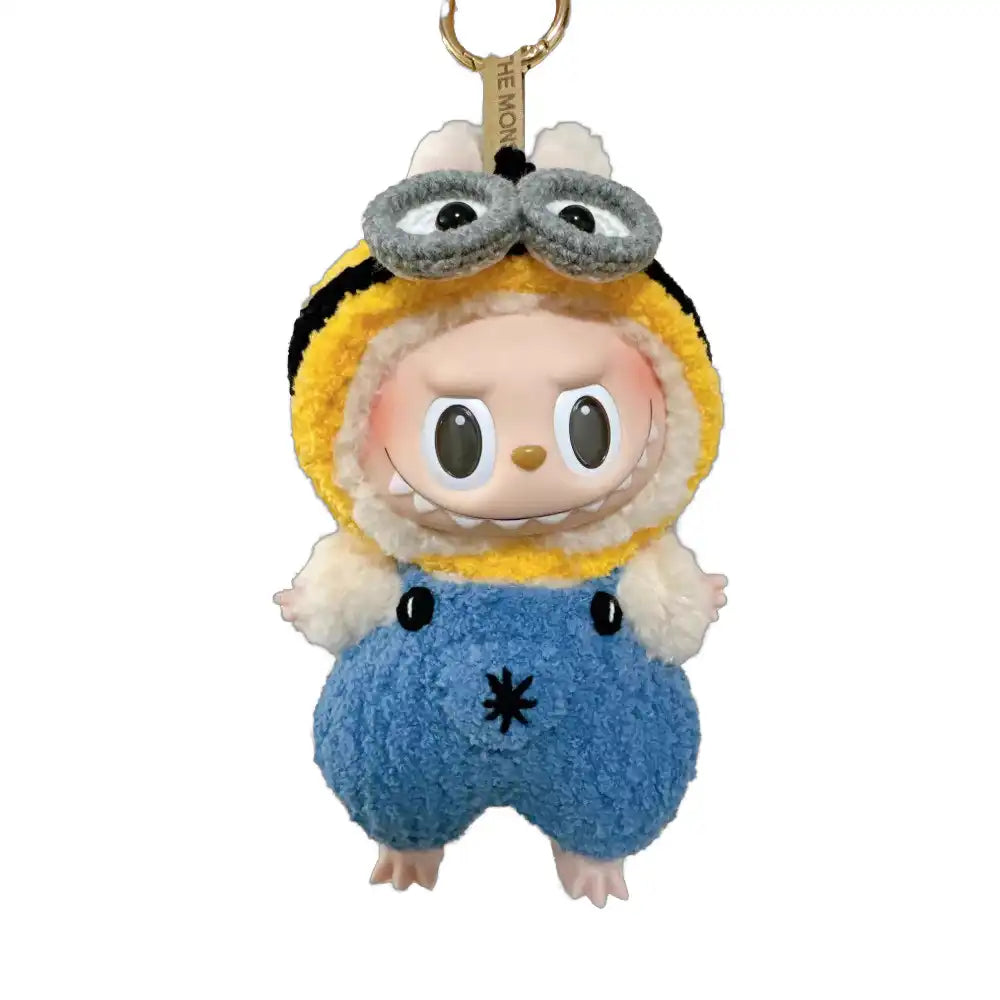 Labubu plush toy wearing a complete Minions-themed Outfit, featuring the iconic yellow body, denim overalls, and goggles.
