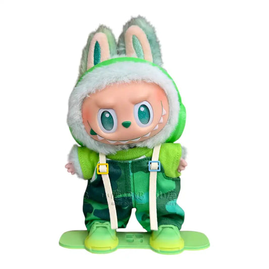 Labubu plush toy wearing a full 4-item Snowboard Camouflage Style Outfit, including a camo top, camo overalls, headphones, and a miniature snowboard.