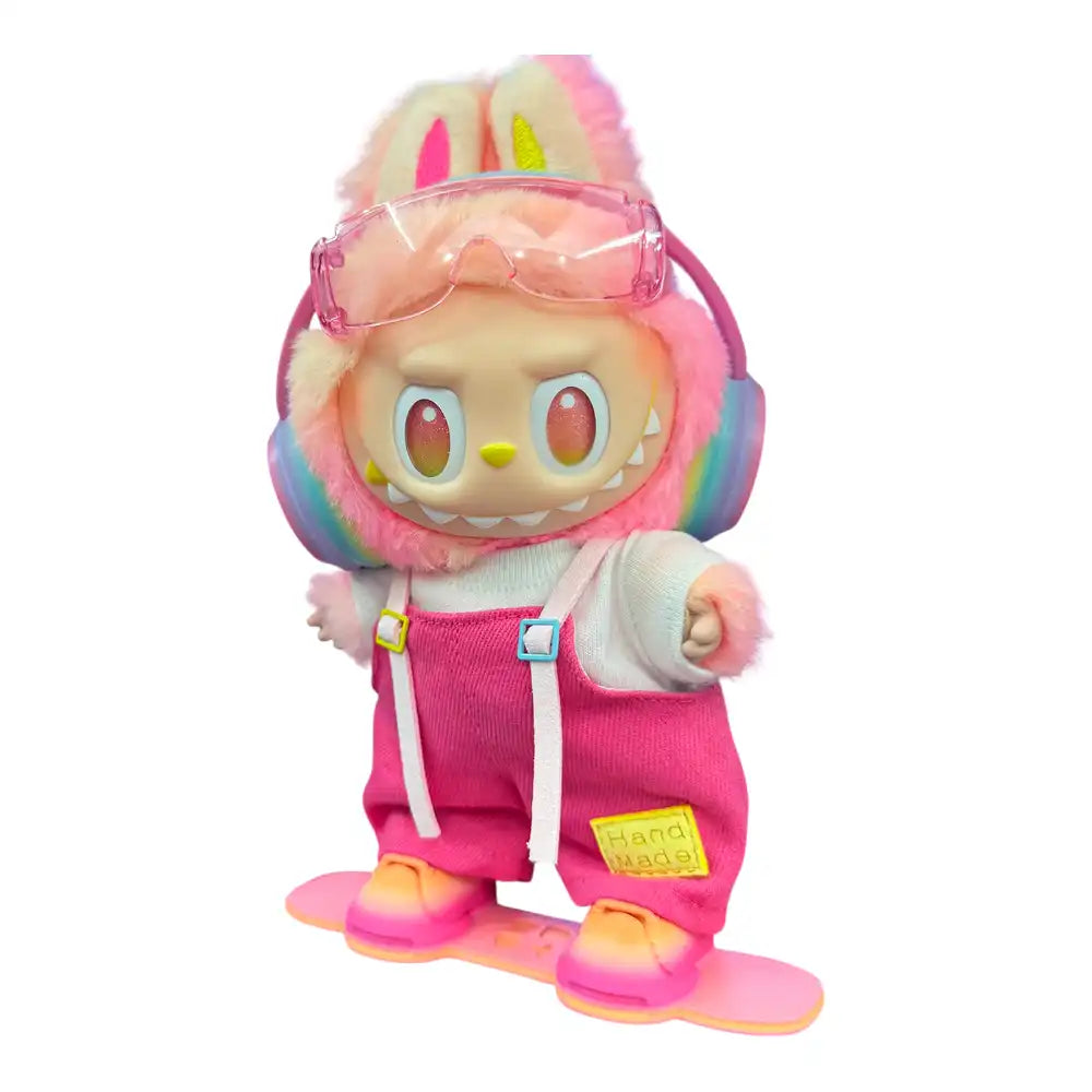 Labubu plush toy wearing a full 5-item Snowboard Pink Outfit, including a pink top, pink overalls, miniature snowboard, ski goggles, and headphones.