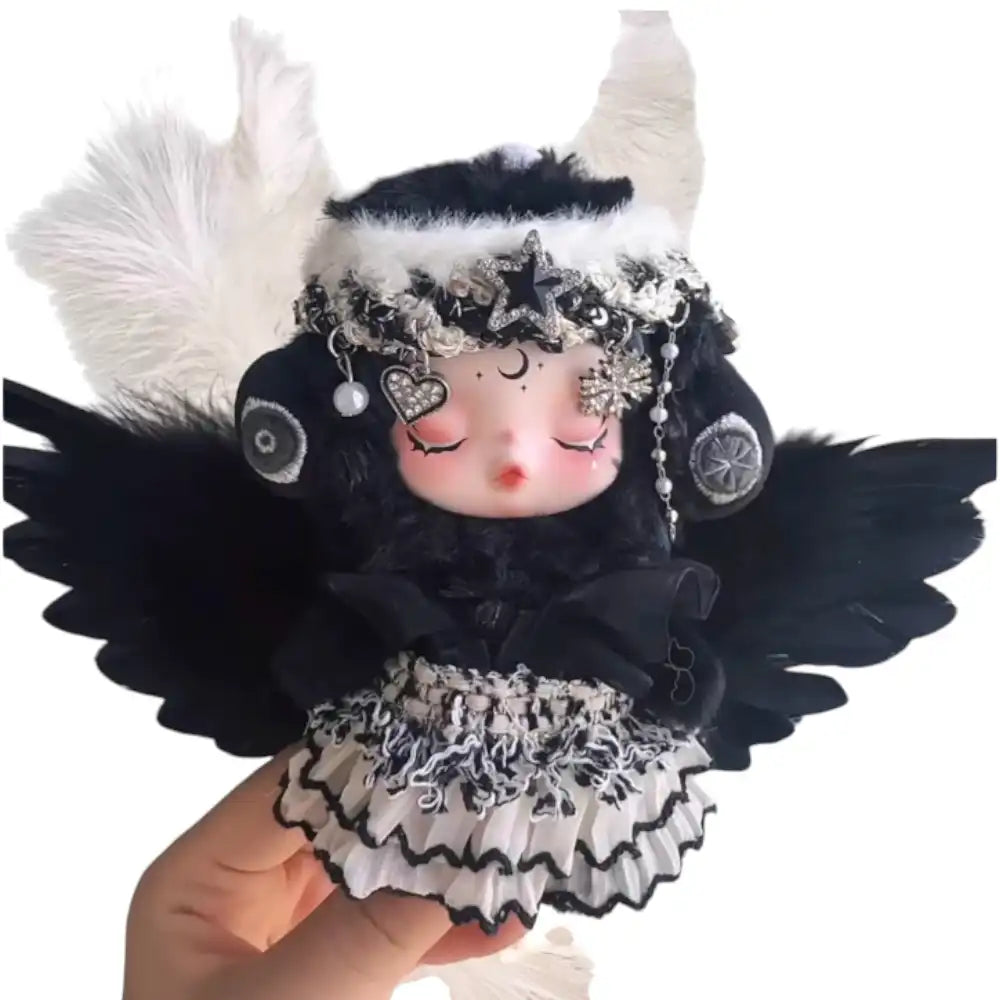 Skullpanda plush figure wearing the Black Angel Outfit, featuring celestial embellished headwear, a gothic plush dress, and dramatic black feather wings.