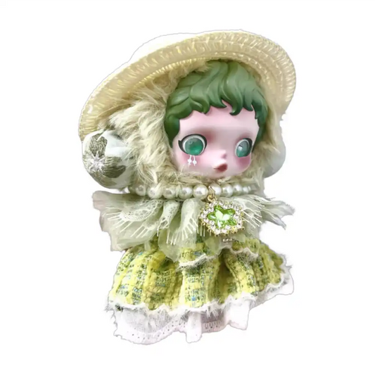 Skullpanda plush figure wearing the Jasmine Princess Outfit, featuring a woven hat, a pearl necklace with an emerald pendant, and a lime green tweed dress with lace trim.